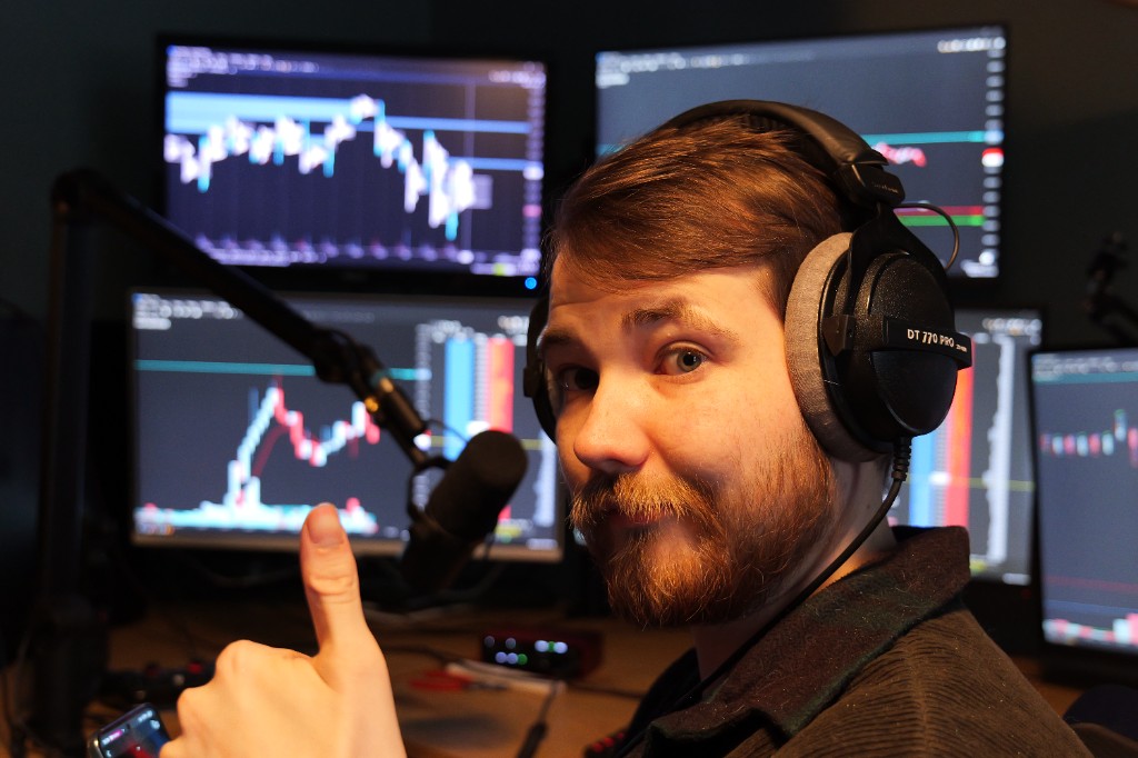 Joakim Jusell during a live trading session with headphones